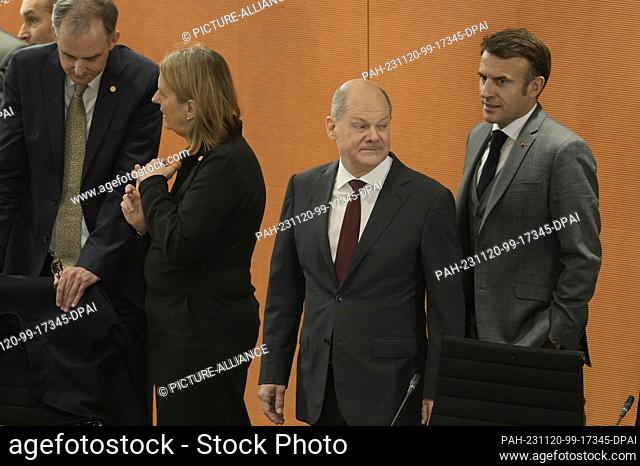 20 November 2023, Berlin: German Chancellor Olaf Scholz (2nd from right) and French President Emmanuel Macron (r) arrive at the ""Compact with Africa""...