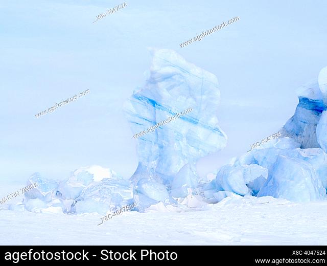 Iceberg in the frozen Mohnbukta in Sabine-Land. The island Spitzbergen in the Svalbard archipelago. Arktic, Europe, Scandinavia, Norway, Svalbard