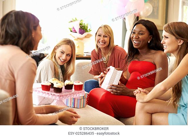 Group Of Female Friends Meeting For Baby Shower At Home