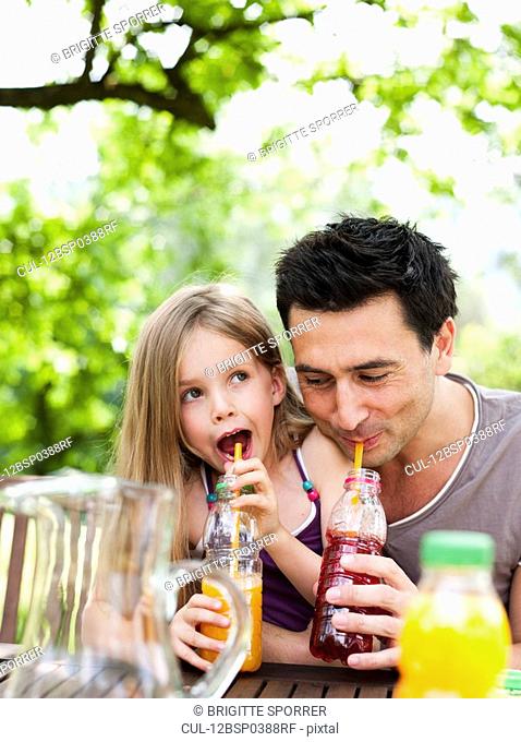 Father And Daughter Drinking