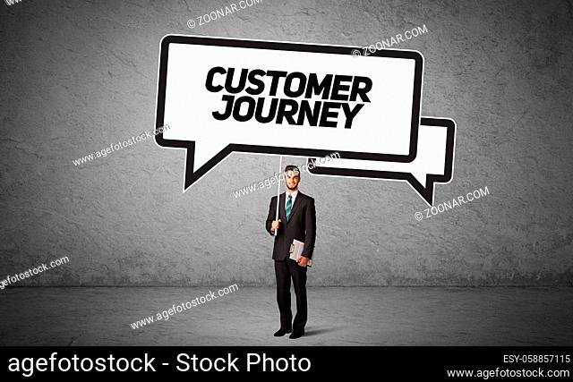 Young business person in casual holding road sign with CUSTOMER JOURNEY inscription, new business idea concept