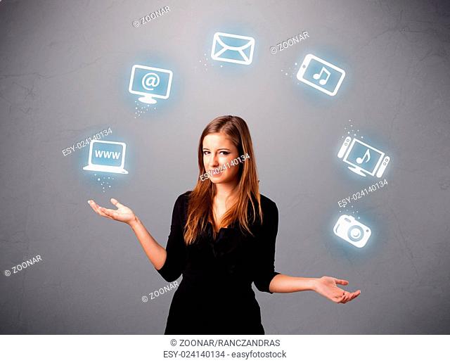 pretty girl juggling with elecrtonic devices icons