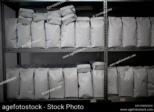 Paper white blank label bags pack on counter at shop shelf products for sales