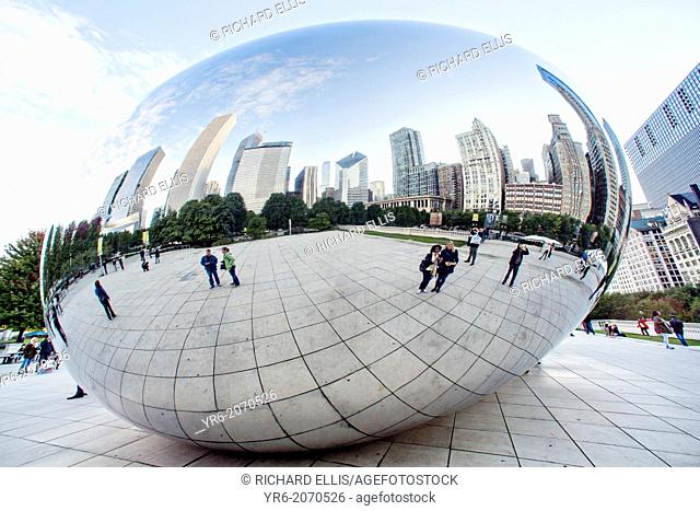 Cloud Gate Sculpture or The Bean with downtown skyline reflected in polished surface Millennium Park in Chicago USA