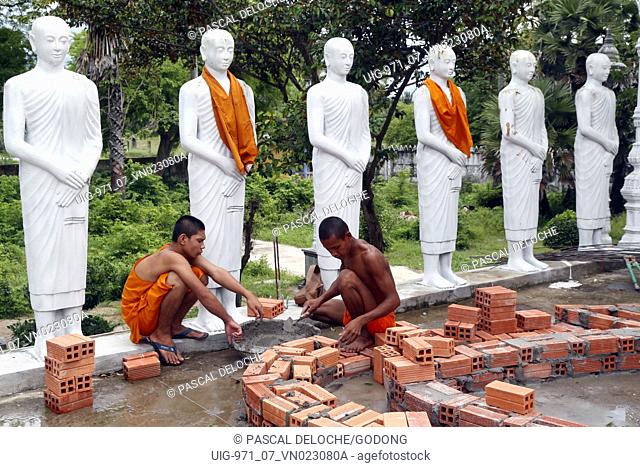 Soc Po Lok buddhist temple. Construction site. Young monks at work. Chau Doc. Vietnam