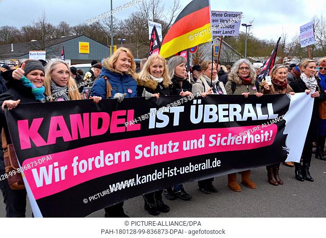 The ""Frauenbuendnis Kandel"" (lit. Kandel women's alliance) marches through the town under the motto ""Sicherheit fuer uns und unsere Kinder"" (lit