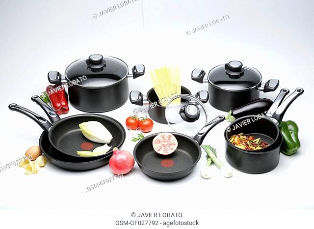 Nonstick kitchenware still life on white background with products inside