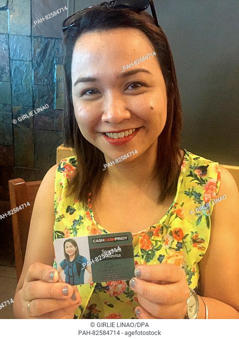 Filipino Spagetthi P. Revisa holds her work ID card up to the camera in Makati City in Manila, Philipines, 26 July 2016. With names such as Delfin, Joker