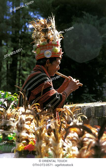 Ifugao playing  the flute, Philippines