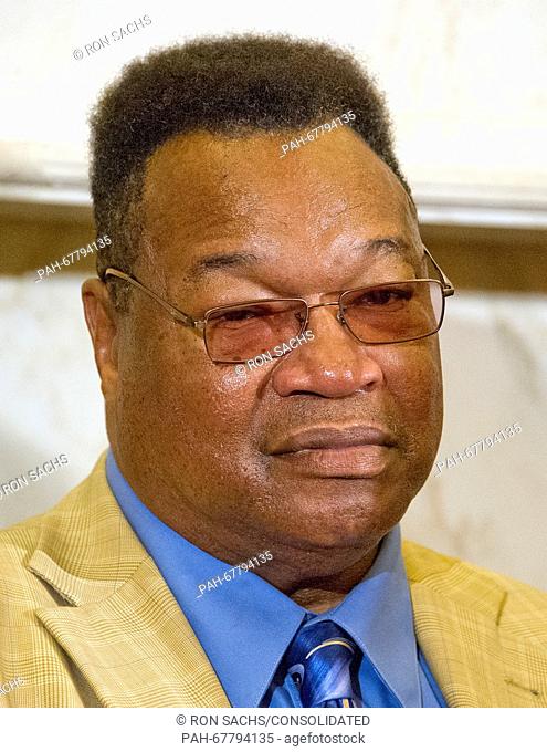 Former World Heavyweight Champion Larry Holmes listens during remarks at a press conference to discuss the observational study on the brain health of active and...