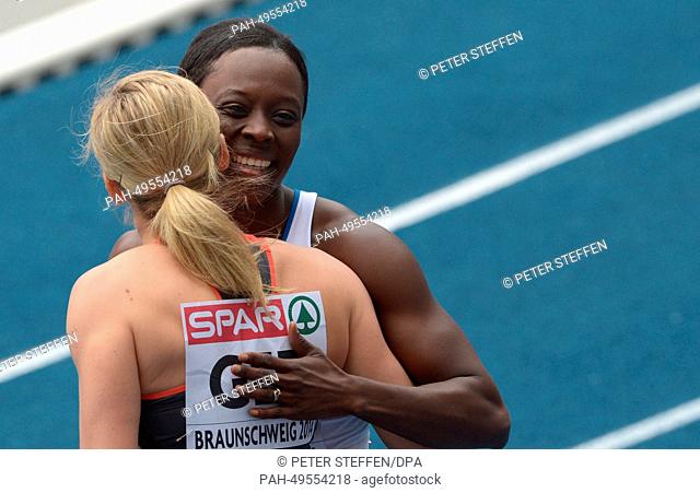 French athlete Myriam Soumare (R) and Germany's Verena Sailer (L) hug each other after the 100 metres race at the European Athletics Team Championships at...