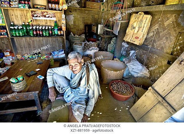 Old man in shop, Marma people, Muzaffar village, Bandarban District, Bangladesh