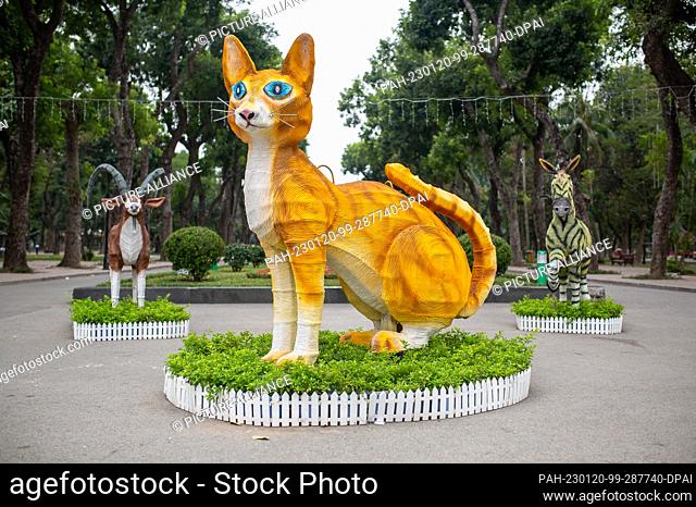 17 January 2023, Vietnam, Hanoi: A two-meter-high cat statue greets visitors to Thong Nhat Park in Hanoi. In Vietnam, countless