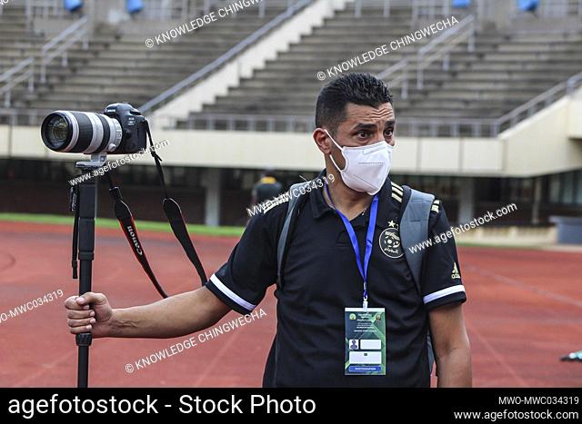 Africa Cup of Nations qualifiers 2020. A photographer during a football match between Zimbabwe and Algeria in Harare. Zimbabwe played its first official soccer...