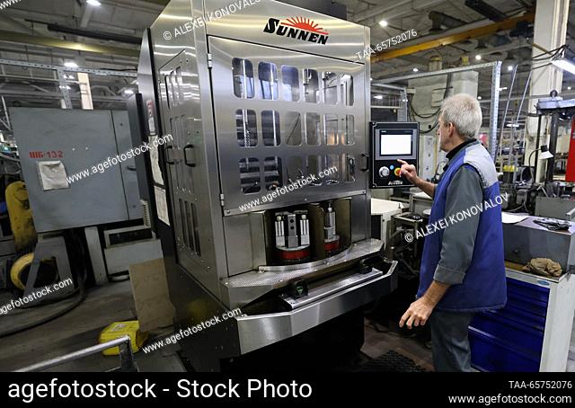 RUSSIA, ZAPOROZHYE REGION - DECEMBER 14, 2023: An employee is at work at the MDK-Gidrosila plant, a producer of hydraulic cylinders for tractors and...