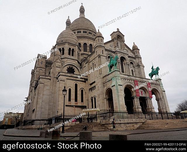 21 March 2020, France, Paris: The Basilica Sacré-Coeur in the Parisian district of Montmartre. The church is closed to visitors for the first time in its...