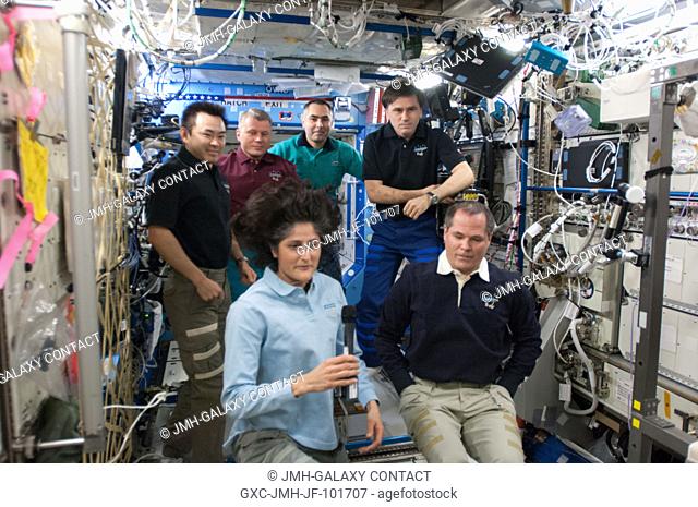Expedition 3233 and Expedition 3334 crew members are pictured in the International Space Station's Destiny laboratory during the ceremony of Changing-of-Command...