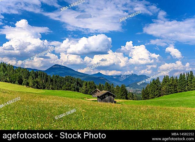 Germany, Bavaria, Werdenfelser Land, Mittenwald, mogul meadows against foothills of the Alps near Isarhorn