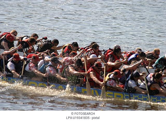 dragon boat racing in Vancouver British Columbia. There are up to 22 people in a boat. Dragon boat racing is largely used as a team building activitey for...