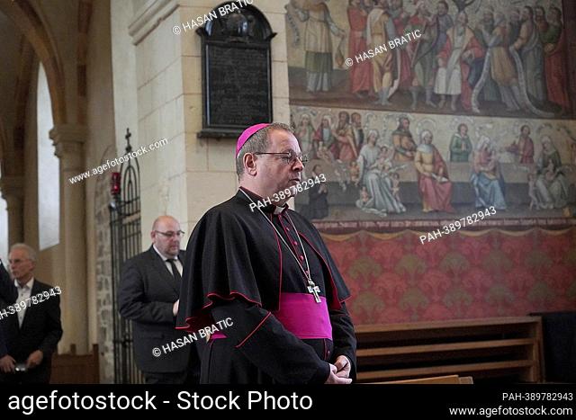 The Limburg Bishop Georg Batzing signs the book of condolence for the retired Pope Benedict in the Limburg Cathedral. Pope Emeritus Benedict XVI
