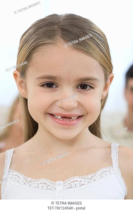Portrait of girl with missing front teeth