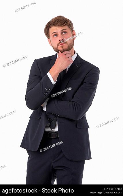 Thinking man isolated on white background. Portrait of serious young pensive businessman looking up at copyspace. Caucasian male model