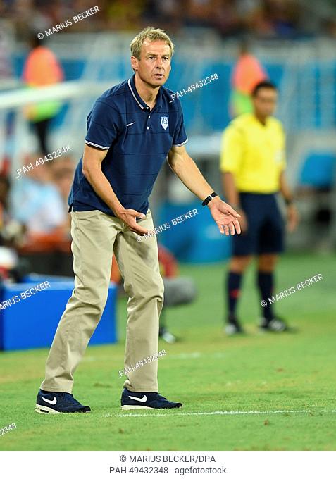 US national soccer team's German head coach Juergen Klinsmann reacts during the FIFA World Cup 2014 group G preliminary round match between Ghana and the USA at...