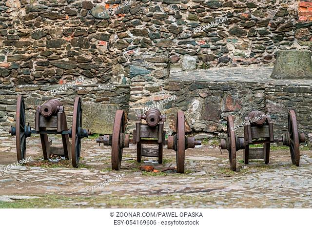 Three old brass cannons in the courtyard of the ruins of the medieval Bolkow Castle in Lower Silesia, Poland