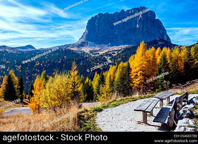 Autumn alpine Dolomites mountain scene, Sudtirol, Italy. Peaceful view near Gardena Pass. Picturesque traveling, seasonal