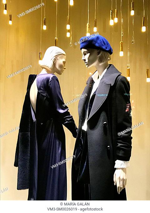 Two mannequins in a shop window. Serrano street, Madrid, Spain