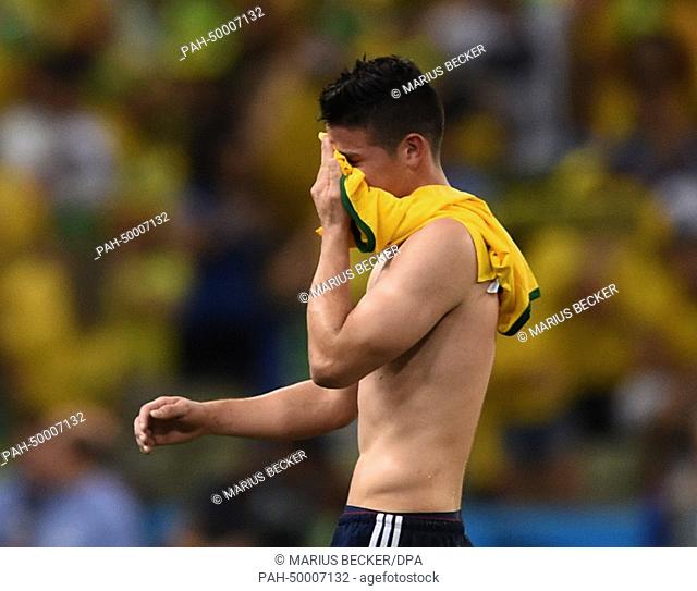 James Rodriguez of Colombia leaves the pitch after the FIFA World Cup 2014 quarter final match soccer between Brazil and Colombia at the Estadio Castelao in...
