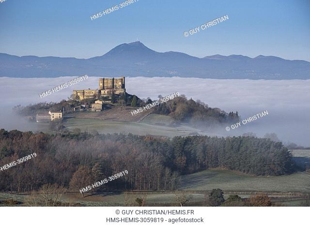 France, Puy de Dome, Montmorin castle in the Natural Regional Park of Livradois Forez and in the background the Auvergne Volcanoes natural park