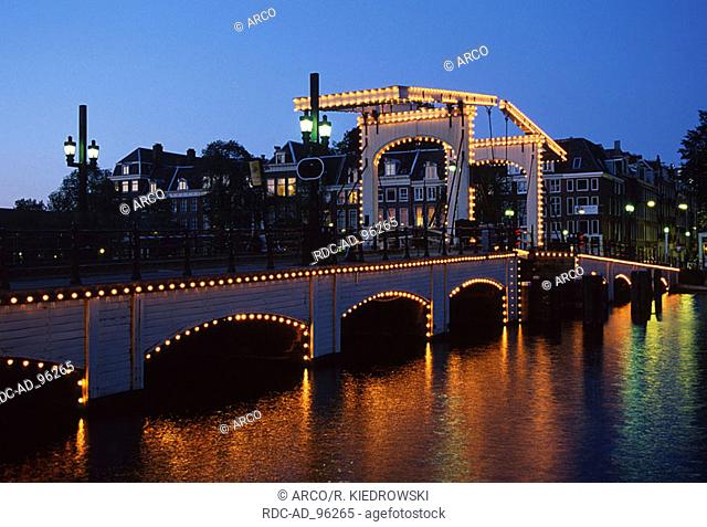 Draw bridge 'Magere Brug' in the evening Amsterdam Netherlands