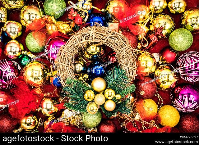 Christmas vibrant colorful wallpaper background texture of balls and decorations for the celebration tree