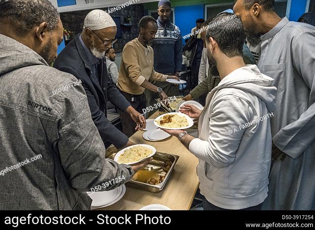 Stockholm, Sweden People eating rice and chicken at the Islamic Cultural Center in Rinkeby, an immigrant suburb, after an community youth event
