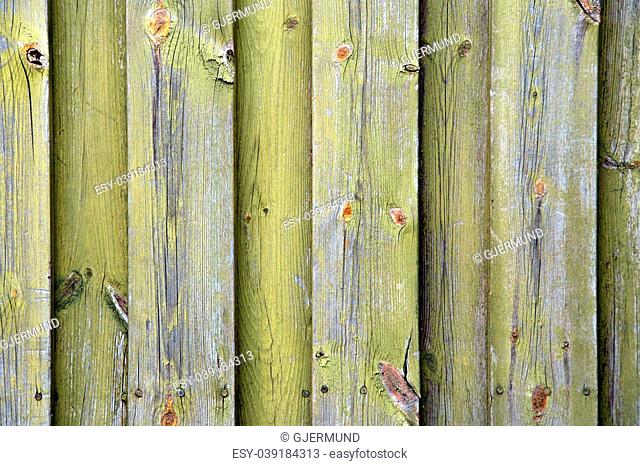 An old wooden wall texture with faded green paint