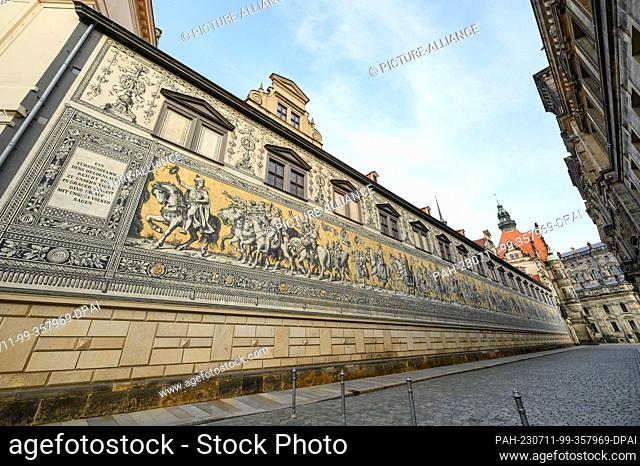 10 July 2023, Saxony, Dresden: Morning view of the Princes' Procession in the Old Town. The 102-meter-long work of art, considered the largest porcelain mural...