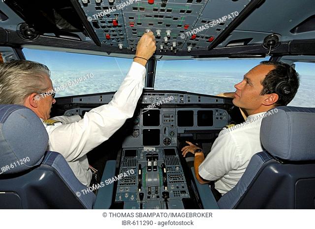 Pilots in the cockpit of an Airbus 321, in flight