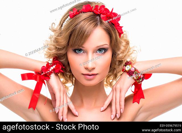 Beautiful blond young woman with red ribbon headband and bracelets. Beauty shot on white background. Isolated. Copy space