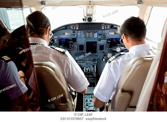 Pilot And Copilot In Cockpit