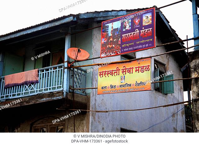 Hoarding on jamshetji tadiwala chawl ; Mahadev Palav Marg ; Curry Road ; Bombay Mumbai ; Maharashtra ; India 26-August-2009
