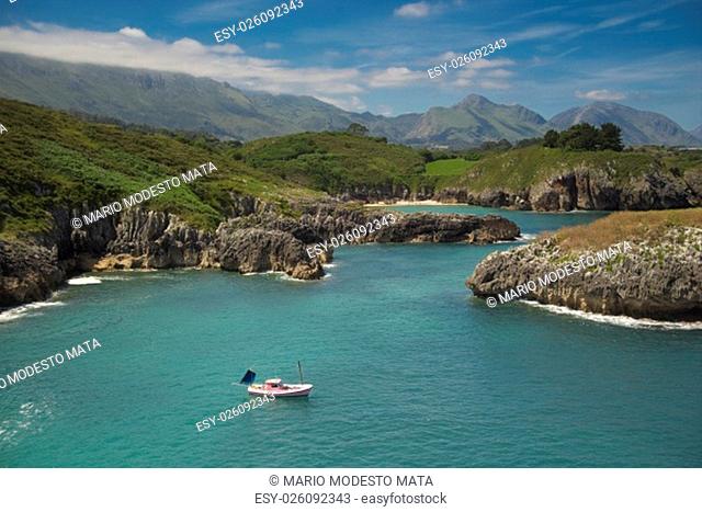 A peaceful and sunny day in Asturias (Spain). The tranquility than can be breathed is astonishing. The sea is quite calm, and the boat doesn't rock