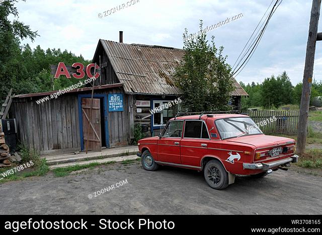 KAMCHATKA PENINSULA, RUSSIAN FAR EAST - 30 JULY, 2018: View of old wooden building of province gas station in Kozyrevsk Village (Ust-Kamchatsky District) and...