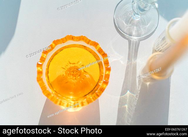 WOman pouring honey in glass bowl. Raw healthy food. High quality FullHD footage