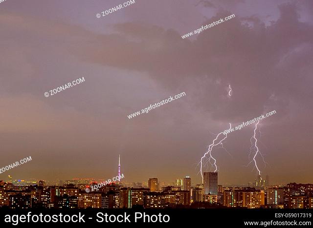 Lightning strike over night city. Moscow, Russia