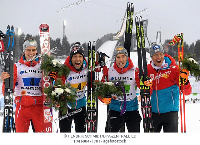 (l-r) Paul Gerstgraser, Philipp Orter, Mario Seidl, Bernhard Gruber from Austria celebrate their bronze medal after the men's team combination normal hill/4x5...