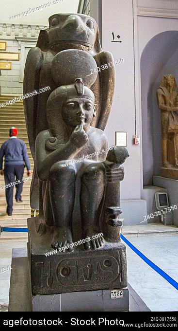 Cairo, Egyptian Museum, Ramses 2 as a child, protected by the hawk god Horoun. Granite, from Tanis. Cryptographic name of the king : Ra Mess Sou