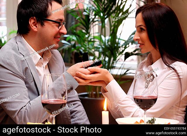 Cute, attractive couple in restaurant