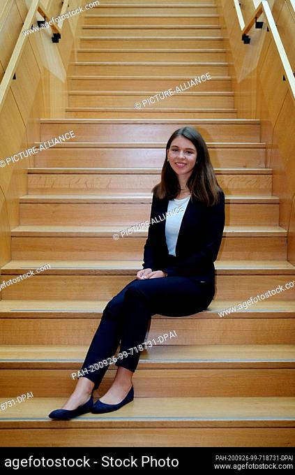 26 September 2020, Saxony-Anhalt, Lutherstadt Wittenberg: Lea-Charlotte Kos sits on a staircase in the town hall at the state party conference of the FDP...