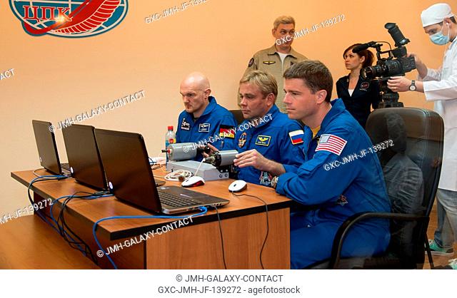 At the Cosmonaut Hotel crew quarters in Baikonur, Kazakhstan, Expedition 4041 Flight Engineer Alexander Gerst of the European Space Agency (left)